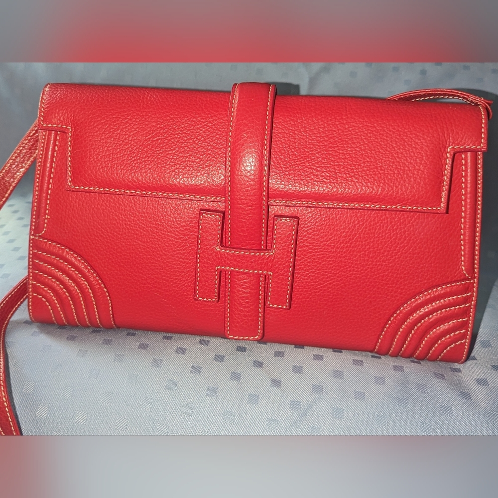 Red leather shoulder bag with contrast stitching